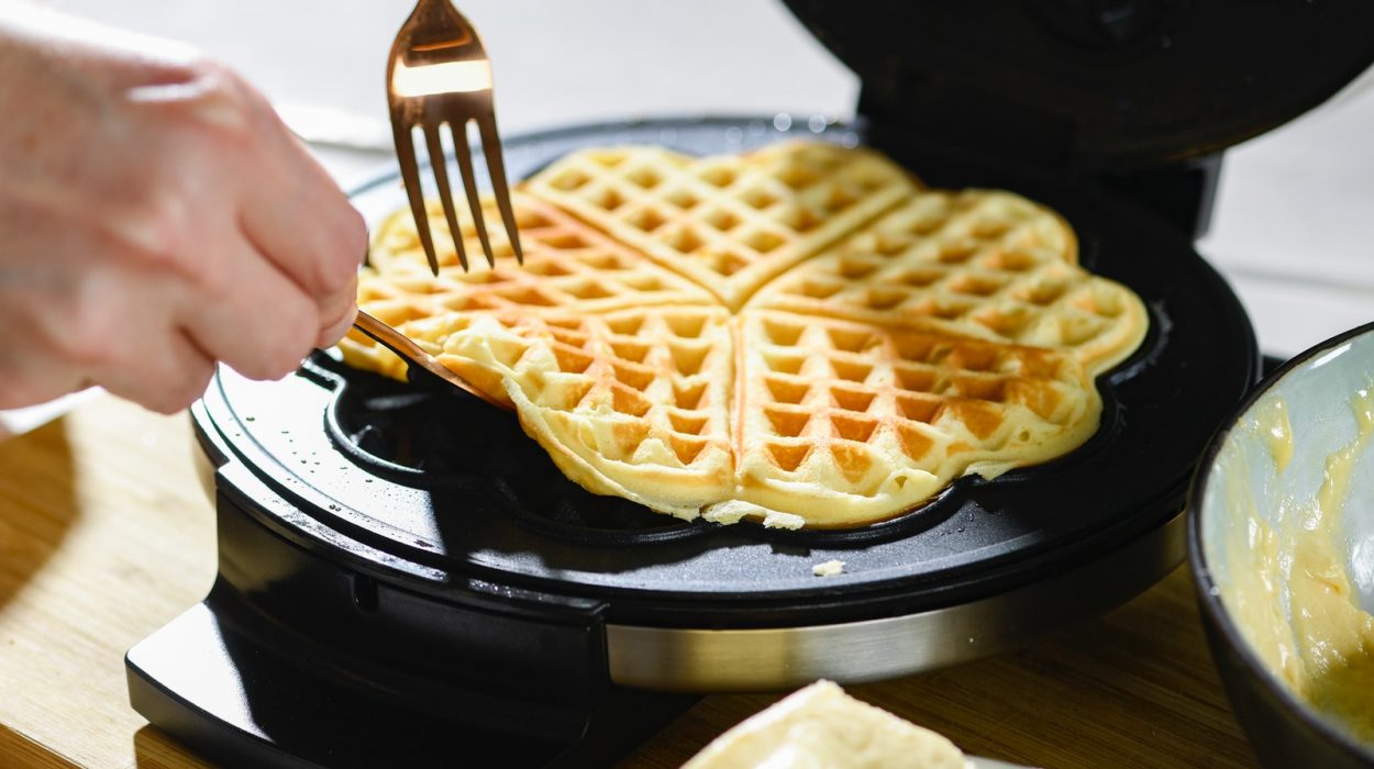 waffle on black pan with white cream