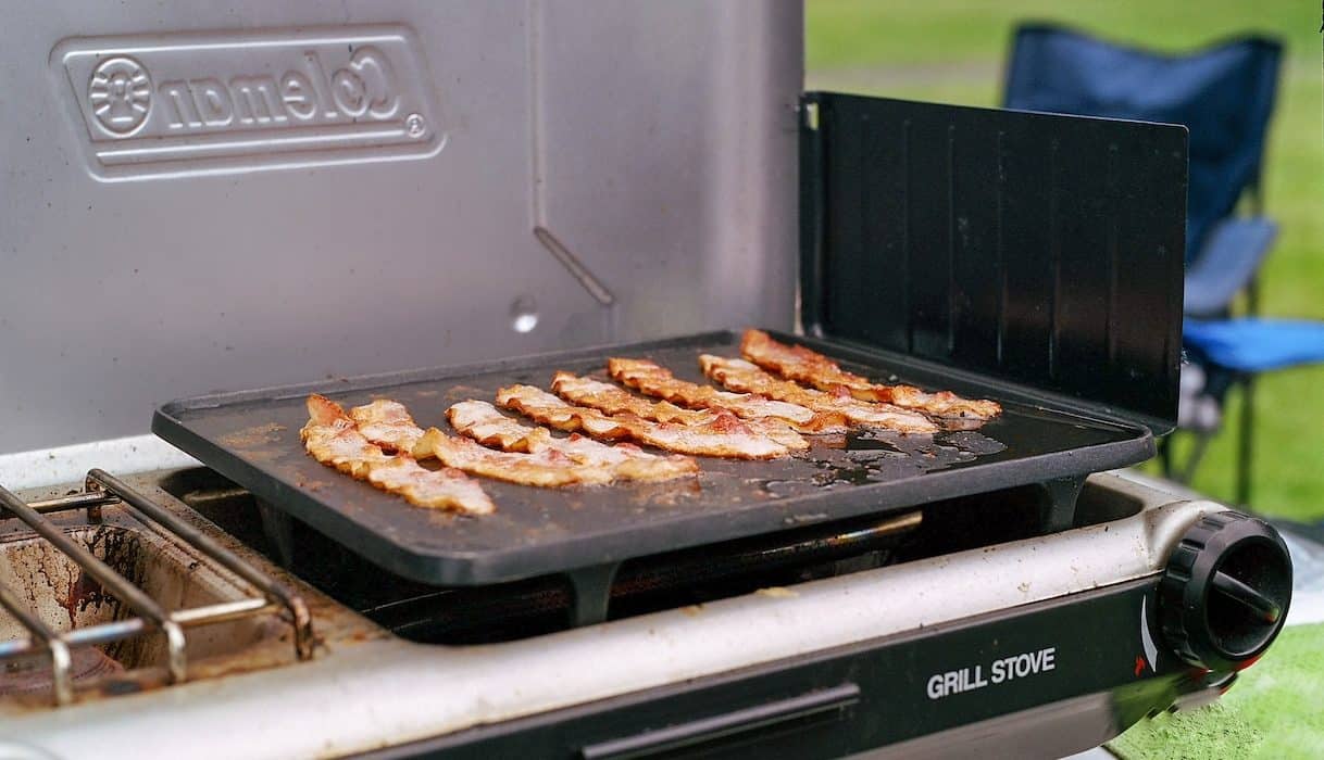a grill that has some meat on it